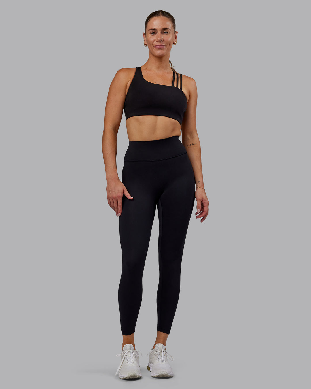 Woman wearing Fusion Ultra High-Rise 7/8 Legging - Black | Model:Hannah | Size:S - view 1