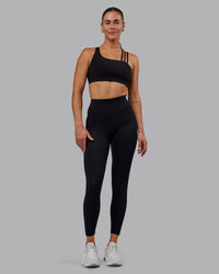 Woman wearing Fusion Ultra High-Rise 7/8 Legging - Black | Model:Hannah | Size:S | Thumbnail Index: 0