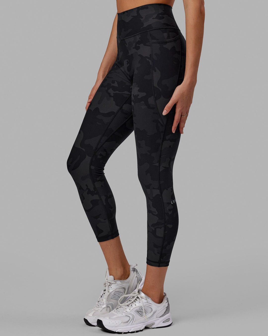 Woman wearing Fusion Ultra High-Rise 7/8 Legging Pockets - Black-Camo | Model:Katie | Size:S - view 2