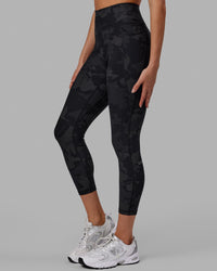 Woman wearing Fusion Ultra High-Rise 7/8 Legging Pockets - Black-Camo | Model:Katie | Size:S | Thumbnail Index: 1