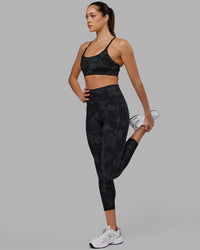 Woman wearing Fusion Ultra High-Rise 7/8 Legging Pockets - Black-Camo | Model:Katie | Size:S | Thumbnail Index: 0