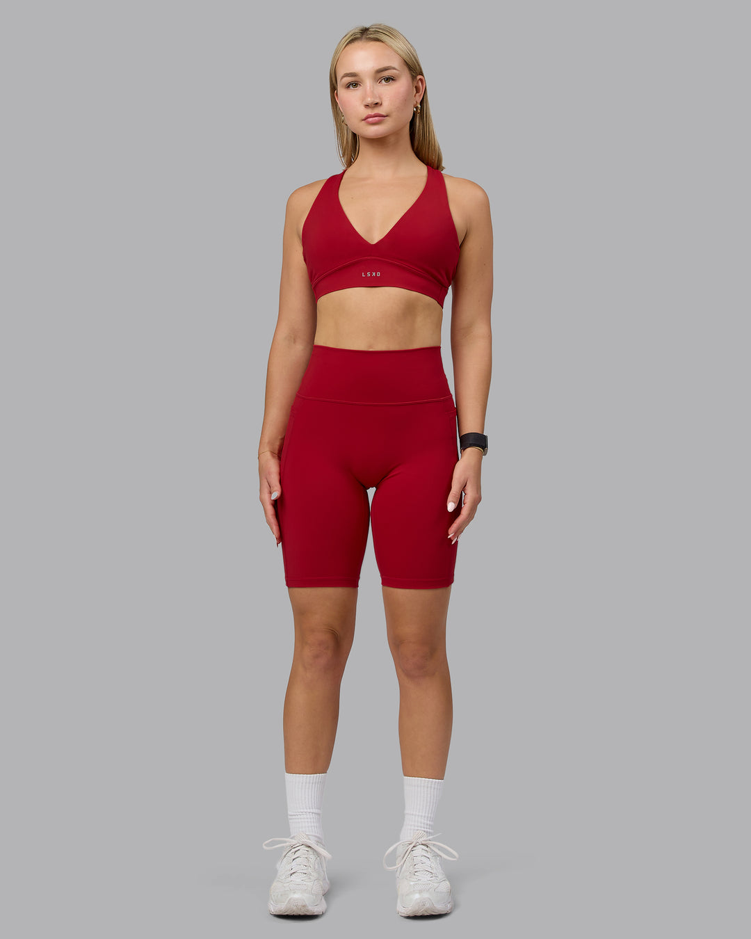Woman wearing Fusion Ultra High-Rise 9" Short Pockets - Cherry Red | Model:Halle | Size:S - view 5