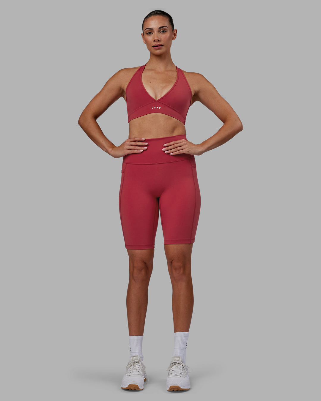 Woman wearing Fusion Ultra High-Rise 9" Short Pockets - Claret | Model:Blaize | Size:S - view 6