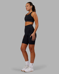 Woman wearing Fusion Ultra High-Rise 9" Short Pockets - Black | Model:Kirstyn | Size:S | Thumbnail Index: 4