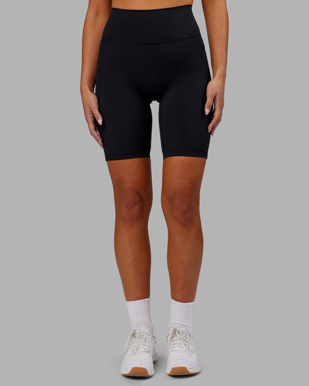 Woman wearing Fusion Ultra High-Rise 9" Short Pockets - Black | Model:Kirstyn | Size:S - view 6