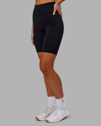 Woman wearing Fusion Ultra High-Rise 9" Short Pockets - Black | Model:Kirstyn | Size:S | Thumbnail Index: 1