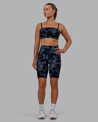 Woman wearing Fusion Ultra High-Rise 9" Short Pockets - Tie Dye-Midnight | Model:Halle | Size:S | Thumbnail Index: 1