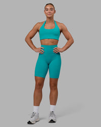 Woman wearing Fusion Ultra High-Rise 9" Short Pockets - Uplift Blue | Model:Monique | Size:S | Thumbnail Index: 0
