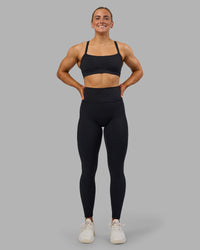 Woman wearing Fusion Ultra High-Rise Full Length Legging Pockets - Black | Model:Georgia | Size:S | Thumbnail Index: 4