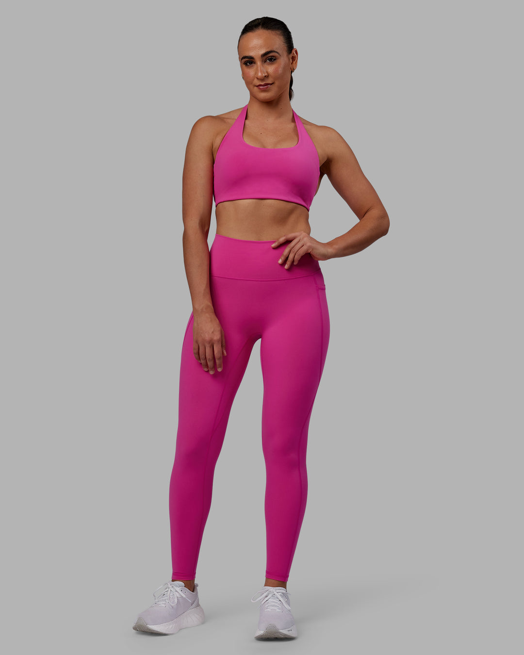 Woman wearing Fusion Ultra High-Rise Full Length Legging Pockets - Fuchsia Pink | Model:Sophie | Size:S - view 1