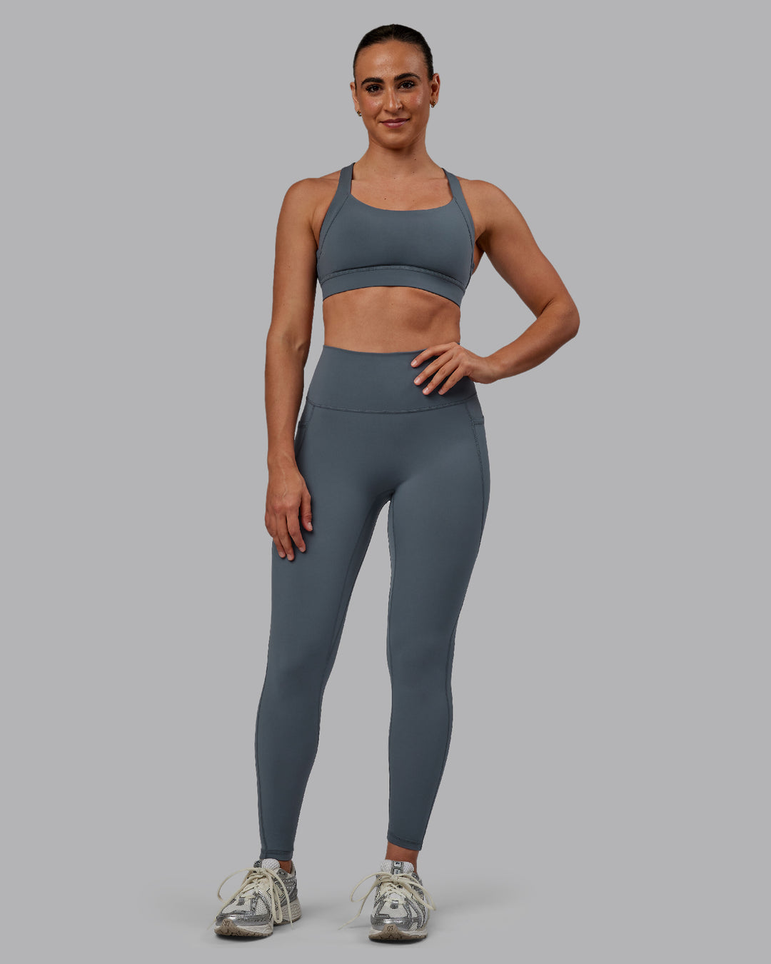 Woman wearing Fusion Ultra High-Rise Full Length Legging Pockets - Turbulence | Model:Sophie | Size:S - view 1
