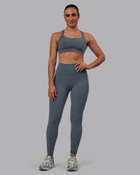 Woman wearing Fusion Ultra High-Rise Full Length Legging Pockets - Turbulence | Model:Sophie | Size:S | Thumbnail Index: 0