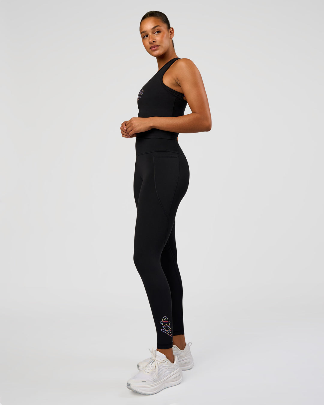 Woman wearing Fusion Graphic Ultra High-Rise Full Length Legging Pockets - Black-Radiate | Model:Rosie | Size:S - view 10
