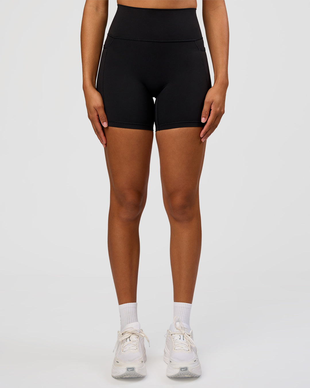 Woman wearing Fusion Graphic Ultra High-Rise 6" Short Pockets - Black-Radiate | Model:Rosie | Size:S - view 2