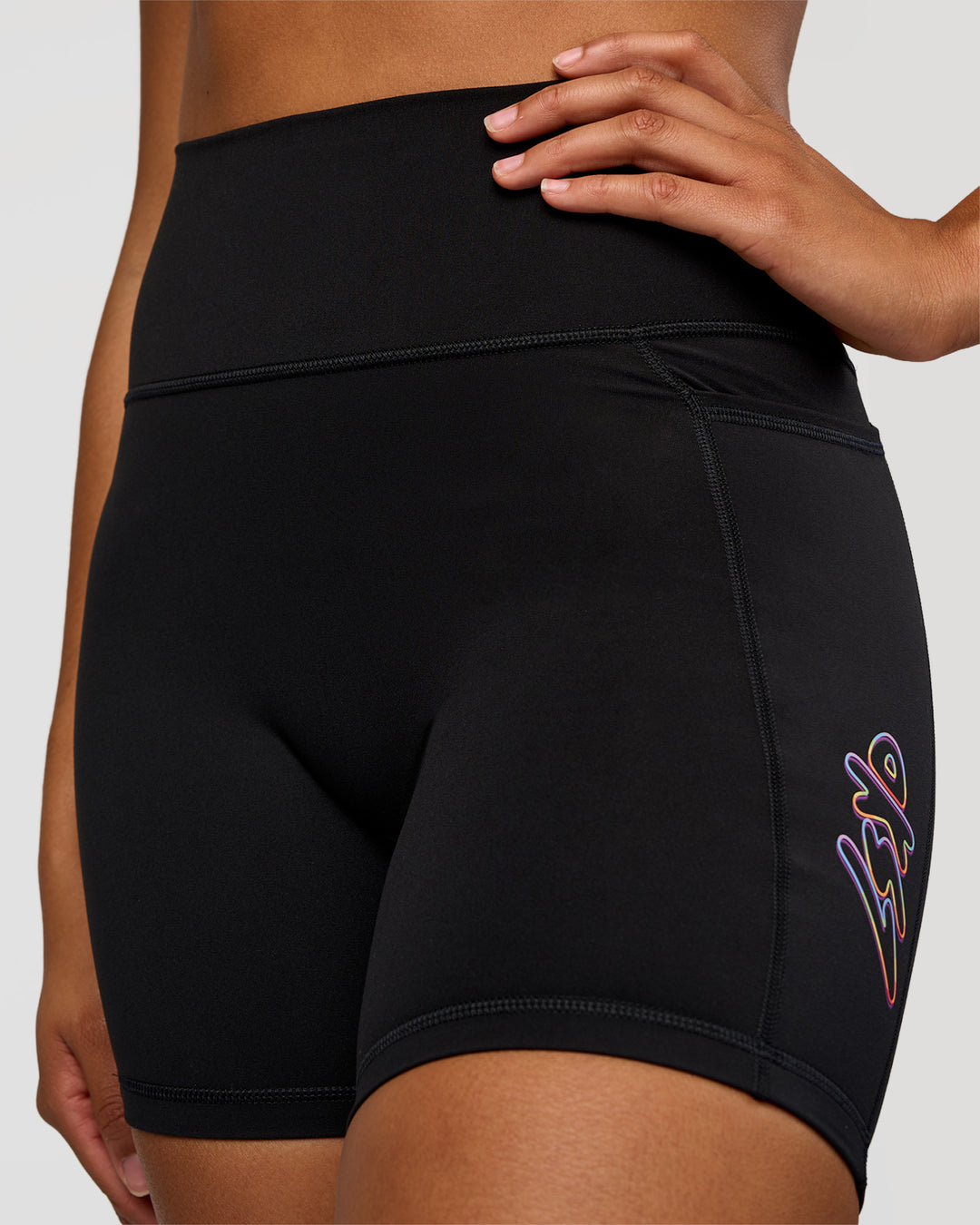Woman wearing Fusion Graphic Ultra High-Rise 6" Short Pockets - Black-Radiate | Model:Rosie | Size:S - view 5