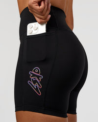 Woman wearing Fusion Graphic Ultra High-Rise 6" Short Pockets - Black-Radiate | Model:Rosie | Size:S | Thumbnail Index: 0