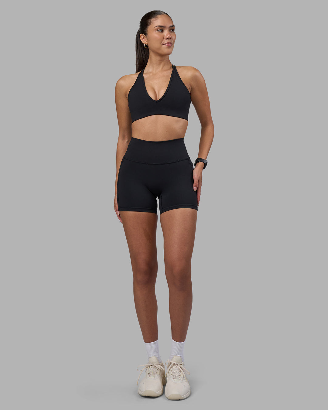 Woman wearing Fusion High-Rise 4" Short Pockets - Black | Model:Rhiley | Size:S - view 2