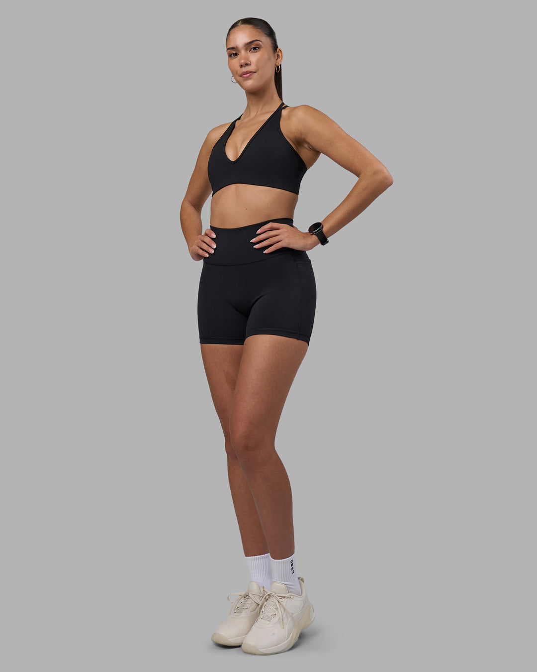 Woman wearing Fusion High-Rise 4" Short Pockets - Black | Model:Rhiley | Size:S - view 5