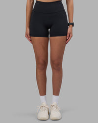Woman wearing Fusion High-Rise 4" Short Pockets - Black | Model:Rhiley | Size:S | Thumbnail Index: 6