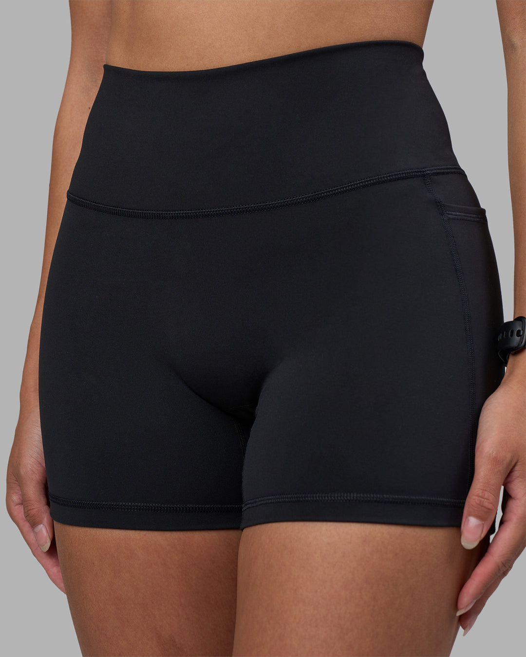 Woman wearing Fusion High-Rise 4" Short Pockets - Black | Model:Rhiley | Size:S - view 6