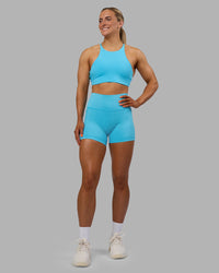 Woman wearing Fusion High-Rise 4" Short Pockets - Blue Atoll | ModelGeorgia | Size:S | Thumbnail Index: 4