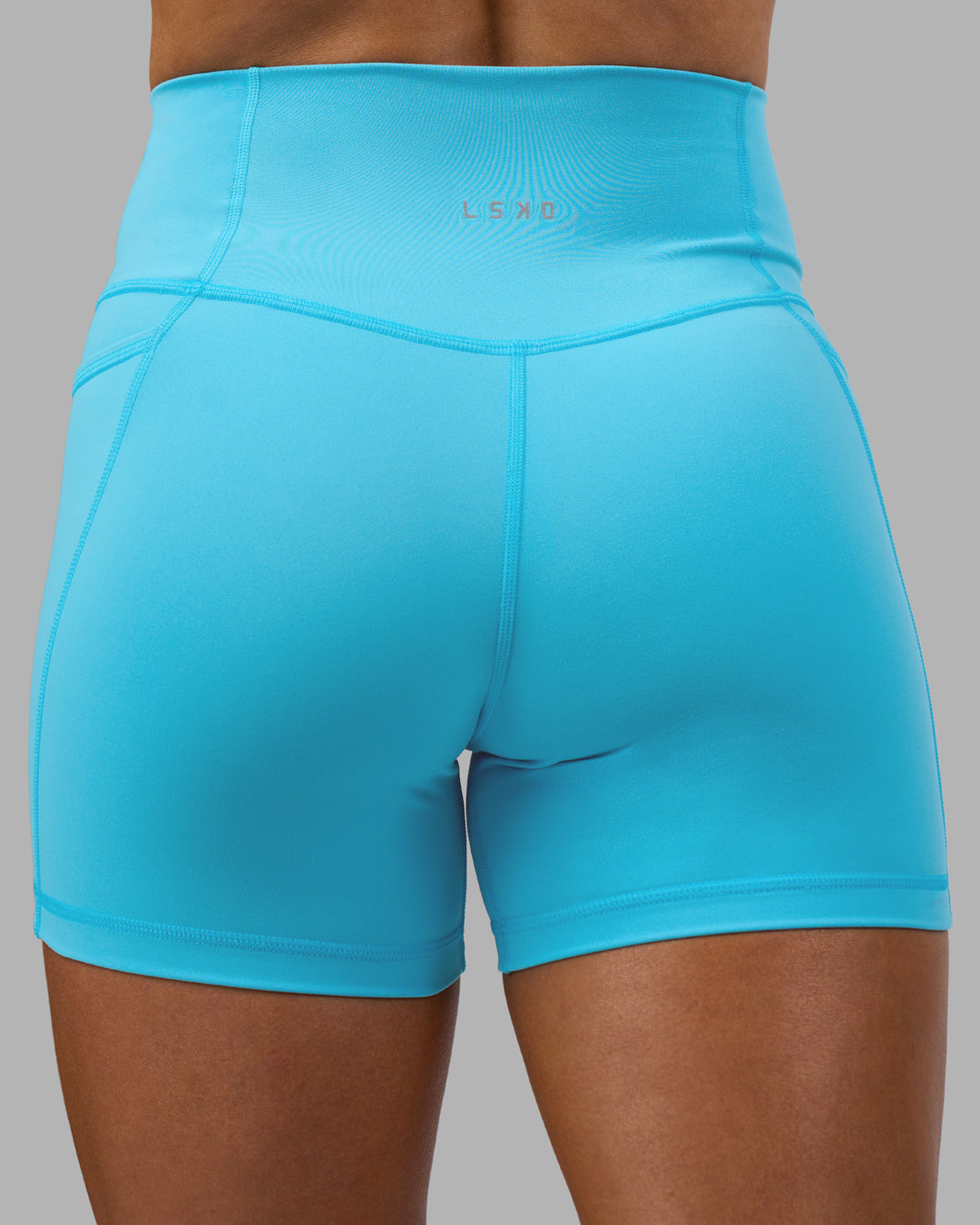 Woman wearing Fusion High-Rise 4" Short Pockets - Blue Atoll | ModelGeorgia | Size:S - view 8