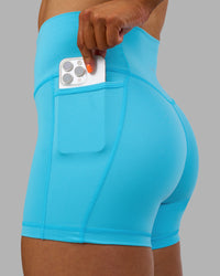 Woman wearing Fusion High-Rise 4" Short Pockets - Blue Atoll | ModelGeorgia | Size:S | Thumbnail Index: 5
