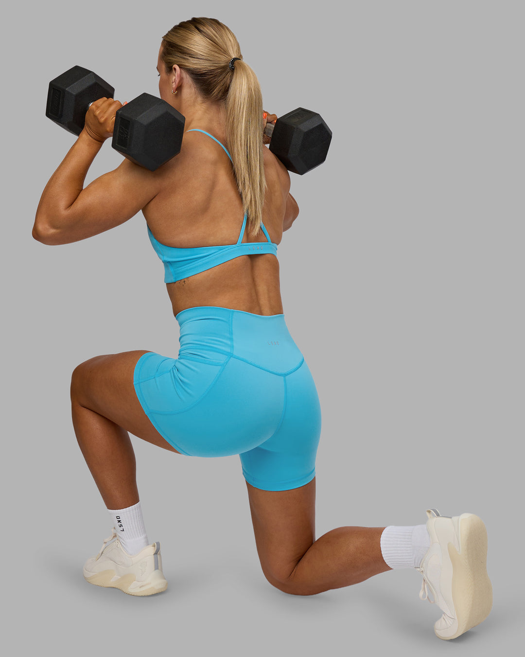 Woman wearing Fusion High-Rise 4" Short Pockets - Blue Atoll | ModelGeorgia | Size:S - view 2