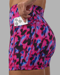 Woman wearing Fusion High-Rise 4" Short Pockets - Pink Luminous | Model:Hannah | Size:S | Thumbnail Index: 0