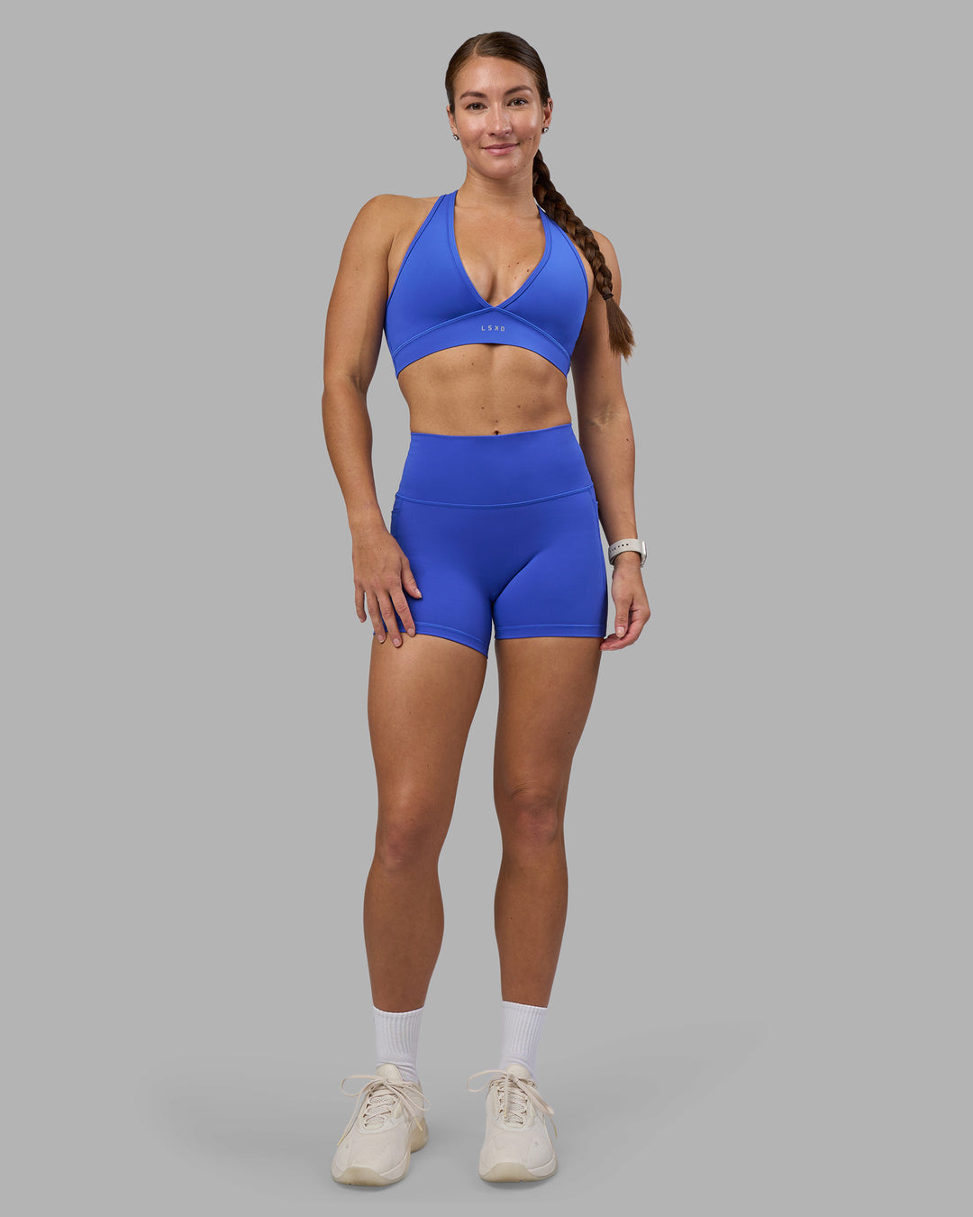 Woman wearing Fusion High-Rise 4" Short Pockets - Power Cobalt | Model:Hannah | Size:S - view 3