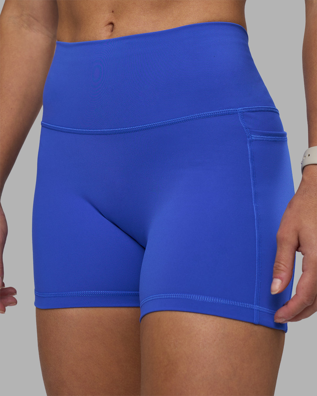 Woman wearing Fusion High-Rise 4" Short Pockets - Power Cobalt | Model:Hannah | Size:S - view 6