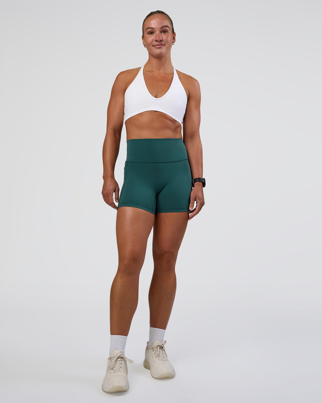 Woman wearing Fusion High-Rise 4" Short Pockets - Transformative Teal | Model:Sav | Size:S - view 2