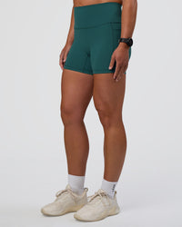 Woman wearing Fusion High-Rise 4" Short Pockets - Transformative Teal | Model:Sav | Size:S | Thumbnail Index: 6