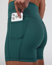 Woman wearing Fusion High-Rise 4" Short Pockets - Transformative Teal | Model:Sav | Size:S | Thumbnail Index: 2