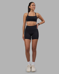 Woman wearing Fusion High-Rise 6" Short Pockets - Black | Model:Rhiley | Size:S | Thumbnail Index: 4