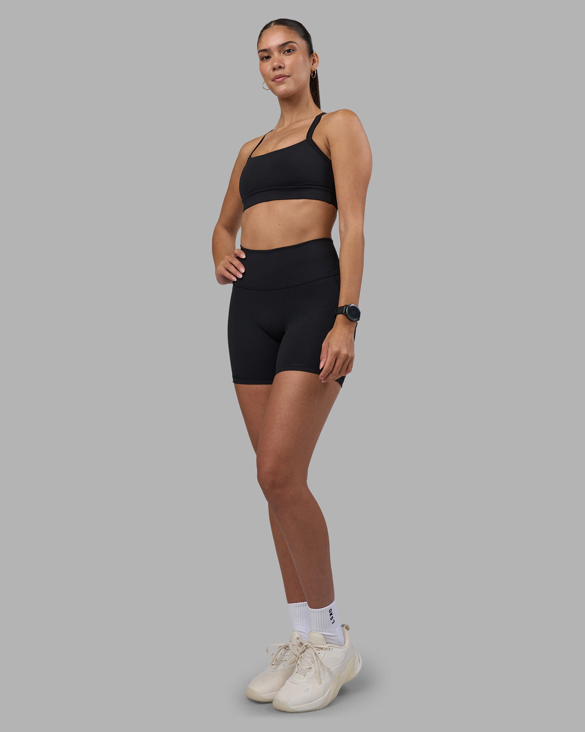 Woman wearing Fusion High-Rise 6" Short Pockets - Black | Model:Rhiley | Size:S