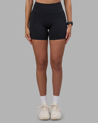 Woman wearing Fusion High-Rise 6" Short Pockets - Black | Model:Rhiley | Size:S | Thumbnail Index: 6