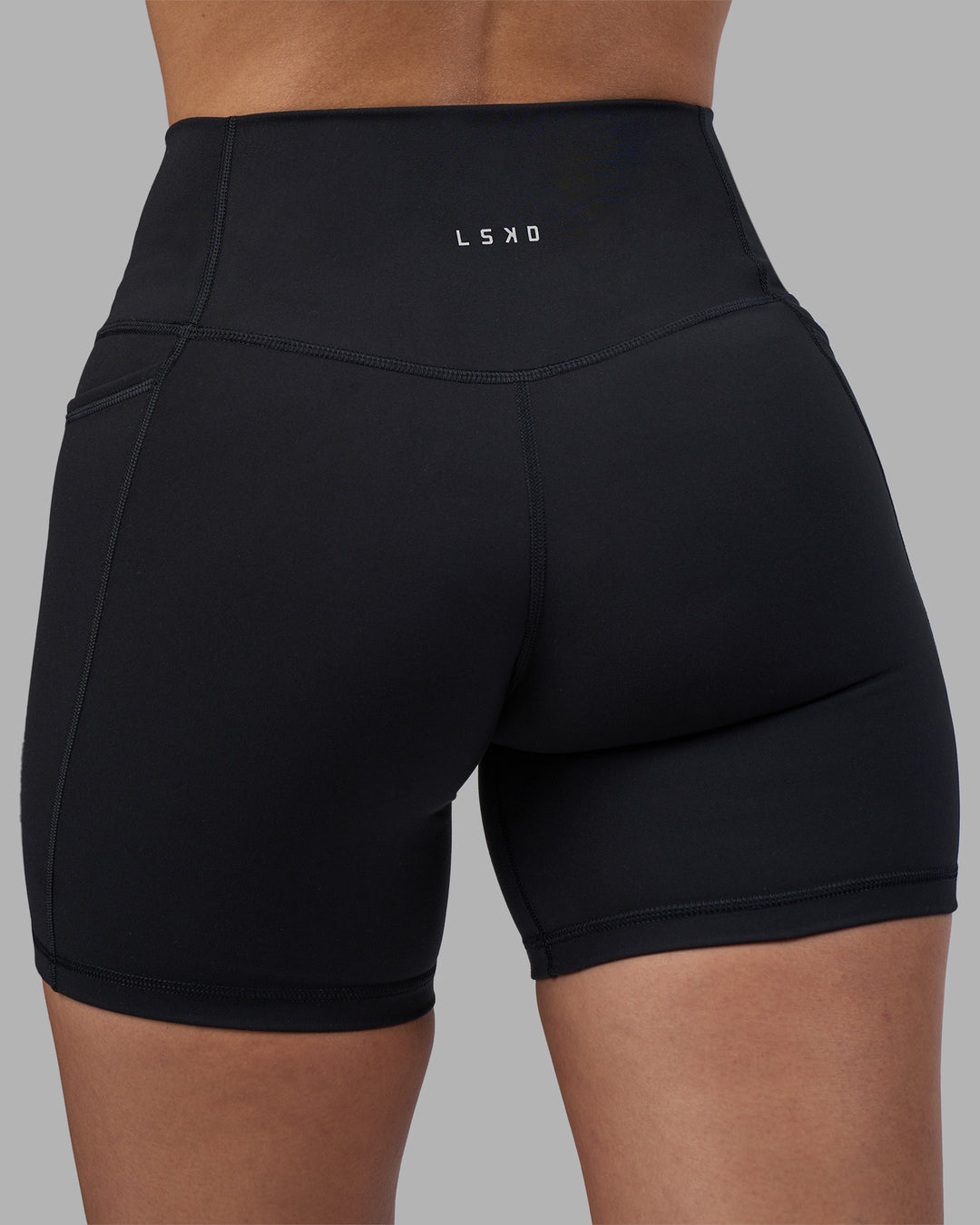 Woman wearing Fusion High-Rise 6" Short Pockets - Black | Model:Rhiley | Size:S - view 8