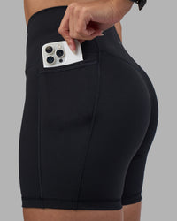 Woman wearing Fusion High-Rise 6" Short Pockets - Black | Model:Rhiley | Size:S | Thumbnail Index: 5