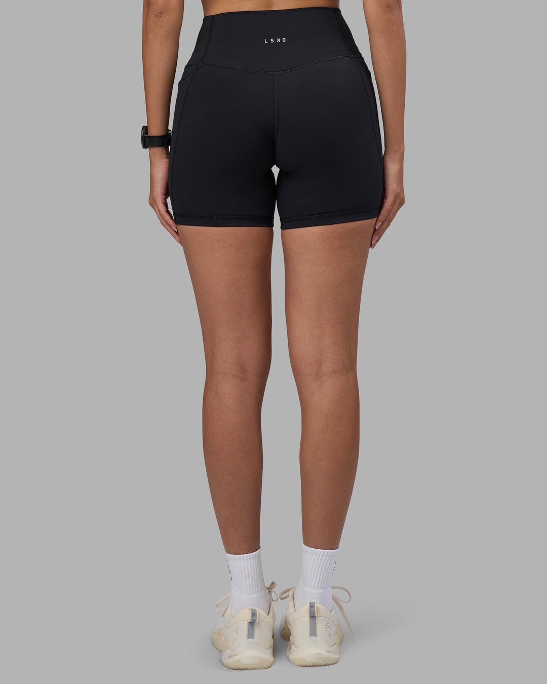 Woman wearing Fusion High-Rise 6" Short Pockets - Black | Model:Rhiley | Size:S - view 4