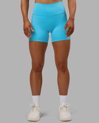 Woman wearing Fusion High-Rise 6" Short Pockets - Blue Atoll | Model:Georgia | Size:S | Thumbnail Index: 6