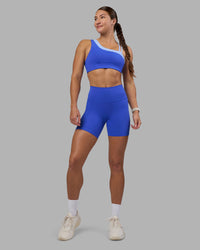 Woman wearing Fusion High-Rise 6" Short Pockets - Power Cobalt | Model:Hannah | Size:S | Thumbnail Index: 0