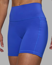 Woman wearing Fusion High-Rise 6" Short Pockets - Power Cobalt | Model:Hannah | Size:S | Thumbnail Index: 1