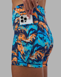 Woman wearing Fusion High-Rise 6" Short Pockets - React Print | Model:Katie | Size:S | Thumbnail Index: 1