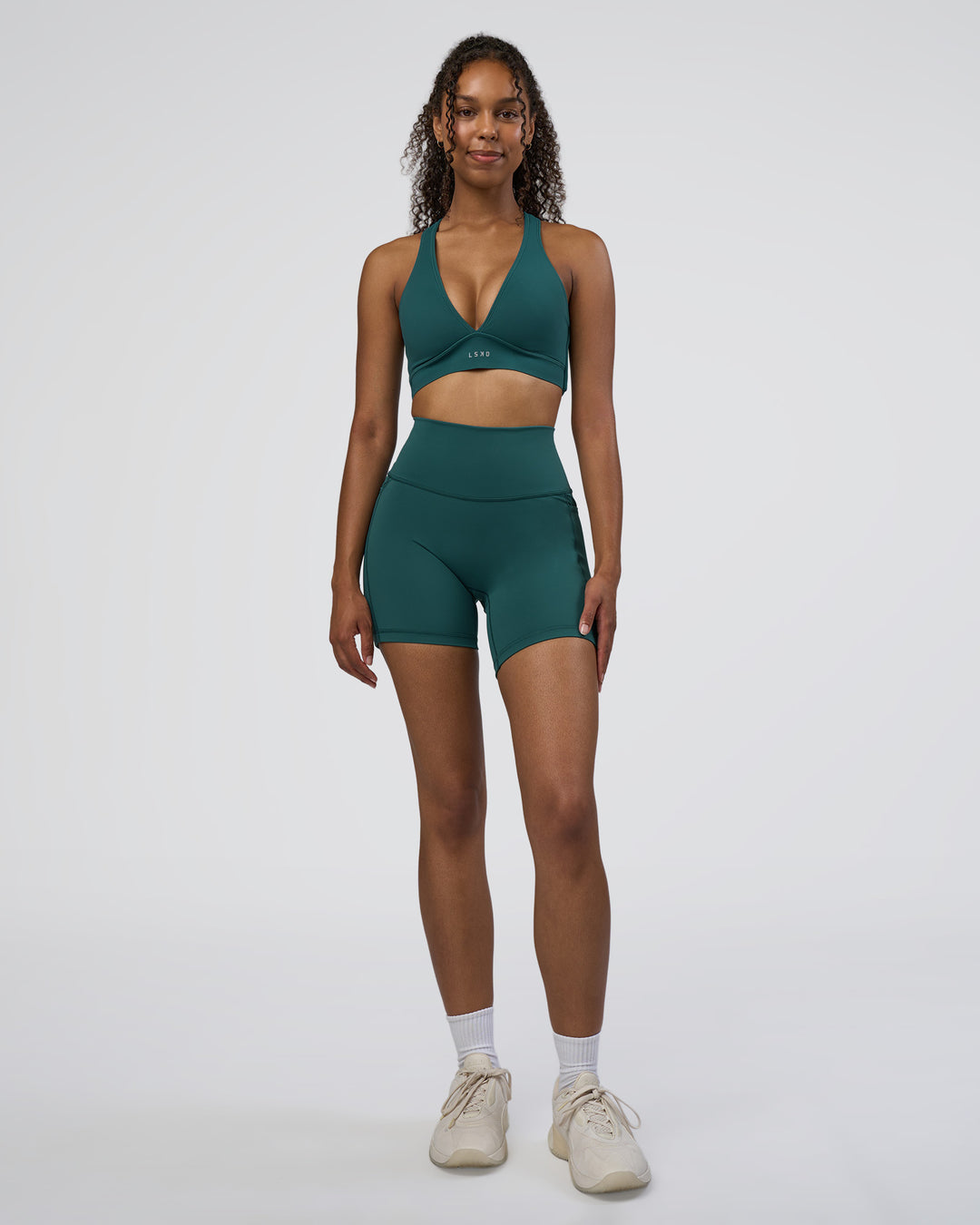 Woman wearing Fusion High-Rise 6" Short Pockets - Transformative Teal | Model:Jordan | Size:S - view 3