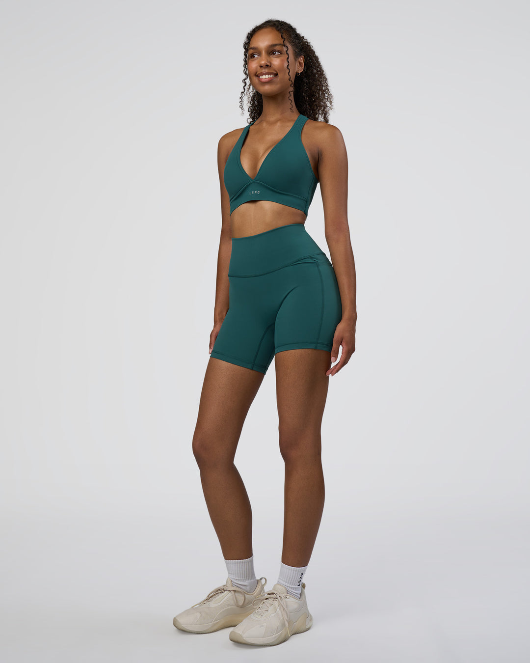 Woman wearing Fusion High-Rise 6" Short Pockets - Transformative Teal | Model:Jordan | Size:S - view 2