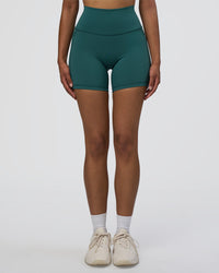 Woman wearing Fusion High-Rise 6" Short Pockets - Transformative Teal | Model:Jordan | Size:S | Thumbnail Index: 0