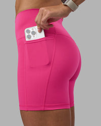 Woman wearing Fusion High-Rise 6" Short Pockets - Ultra Pink | Model:Hannah | Size:S | Thumbnail Index: 0