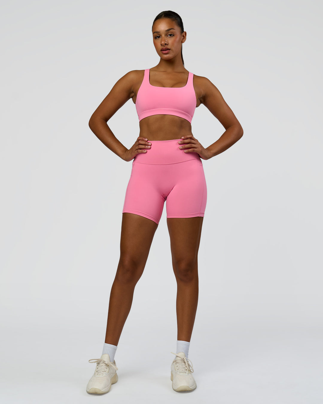 Woman wearing Fusion High-Rise 6" Short Pockets - Candy Pink | Model:Rosie | Size:S - view 3