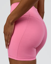 Woman wearing Fusion High-Rise 6" Short Pockets - Candy Pink | Model:Rosie | Size:S | Thumbnail Index: 9